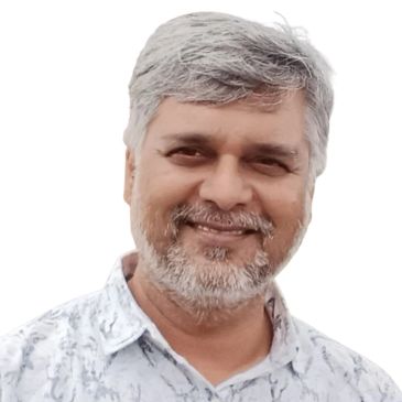 Smiling middle-aged man with gray hair and beard.