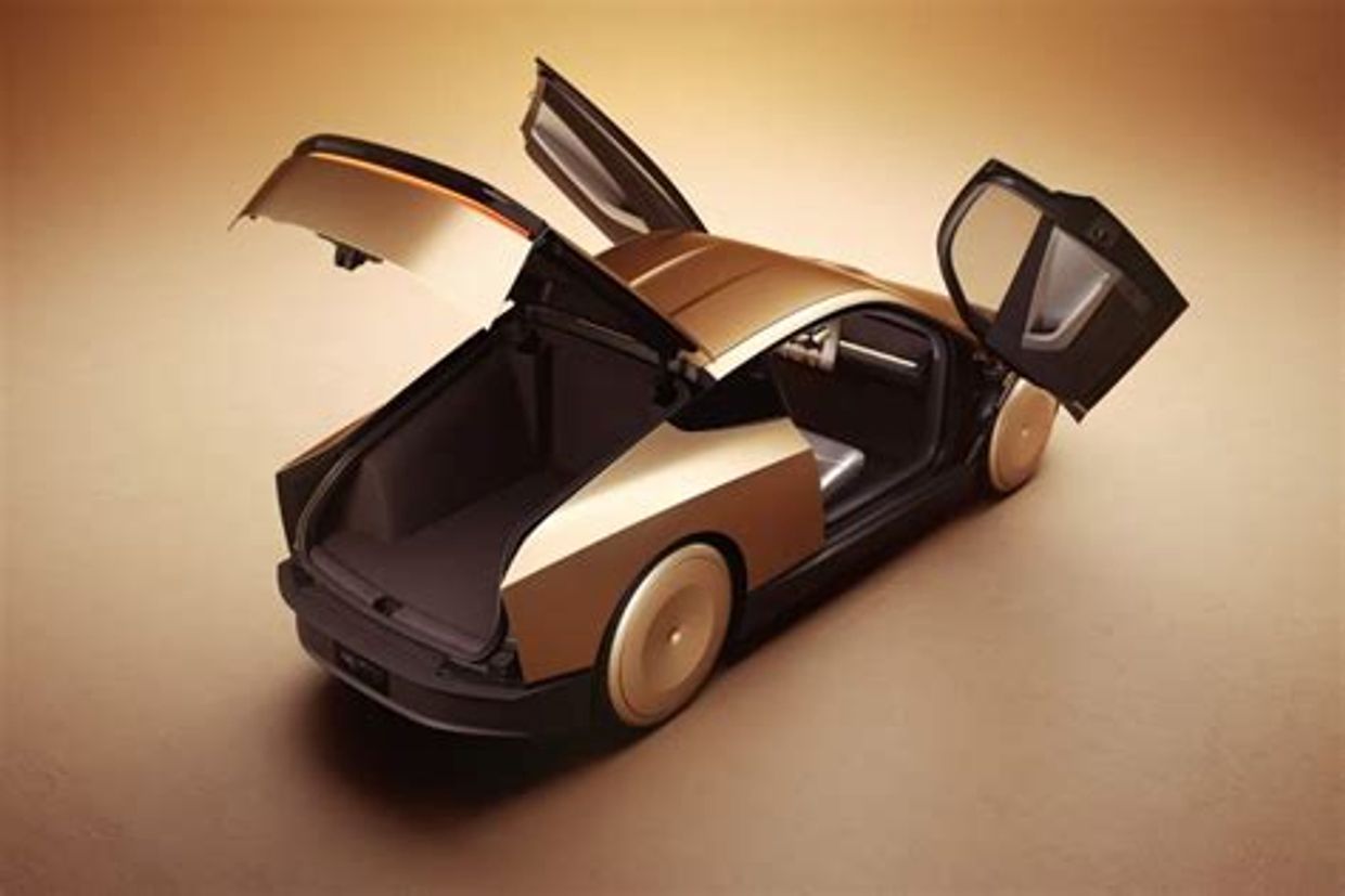 Futuristic car with open doors and trunk.