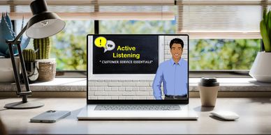 Scenario Based Learning-A laptop opened on top of a desk showing a course titled Active Listening. 