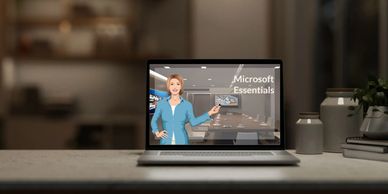 Software simulation-A laptop opened on top of a desk showing a course titled Microsoft Essentials. 