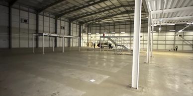 Final handover of commercial premises after the soft strip removal of 1800 bays of racking.