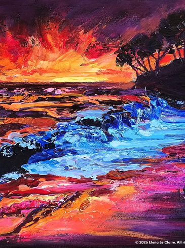 Vibrant sunset over a textured ocean with silhouetted trees.