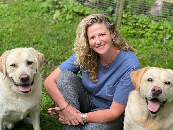 owner and dogs smiling 