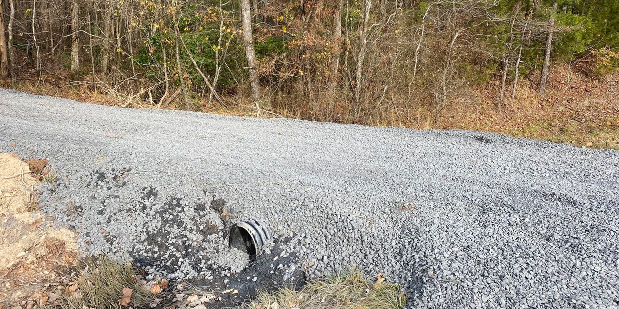 Gravel driveway with water culvert
