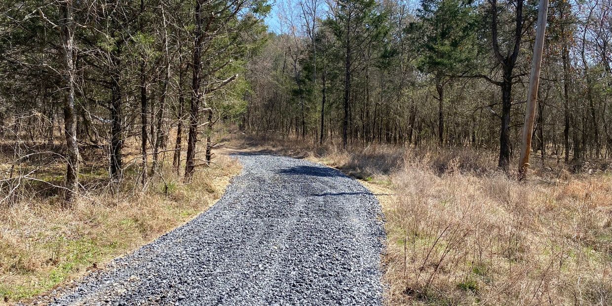 Gray gravel driveway.