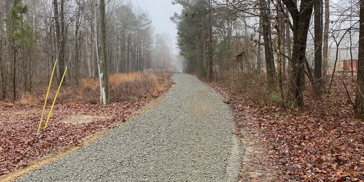 Long gray gravel driveway 
