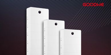 Three white vertical solar inverters of different sizes with GoodWe logo.