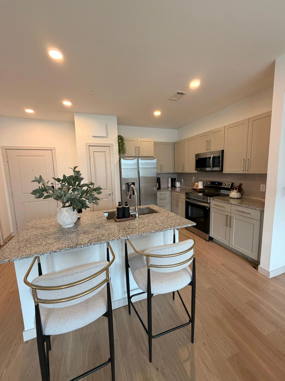 A tidy kitchen with clear granite counters from the Orange Cleaning gallery