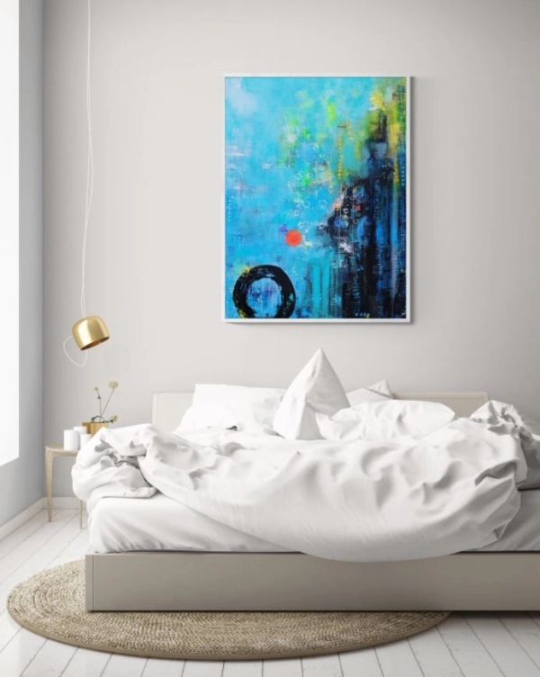 Modern bedroom with white bedding and abstract blue wall art.