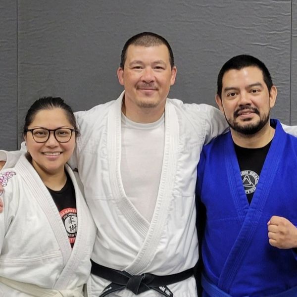 Andre Kikunaga-Sensei (blue gi) with Professor Henry Akins. 