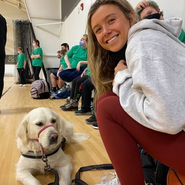 Nicole Hindman training a dog a special Olympics. 