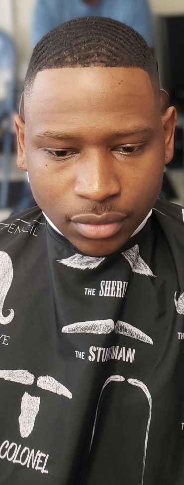 Man with fresh short haircut and waves.