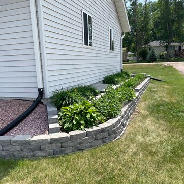 Landscape retaining wall and flowers