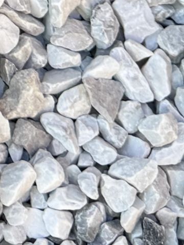 Close-up of light gray and white gravel stones.