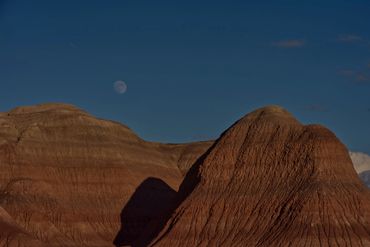 near full moon over badlands Petrified Forest National Park, Arizona from old US Highway 260