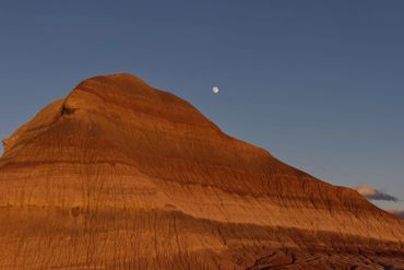 near full moon over badlands Petrified Forest National Park, Arizona from old US Highway 260
