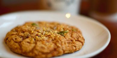 Close-up of a cookie on a white plate.