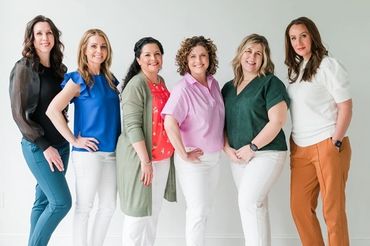 A group of ladies posing for a picture.
