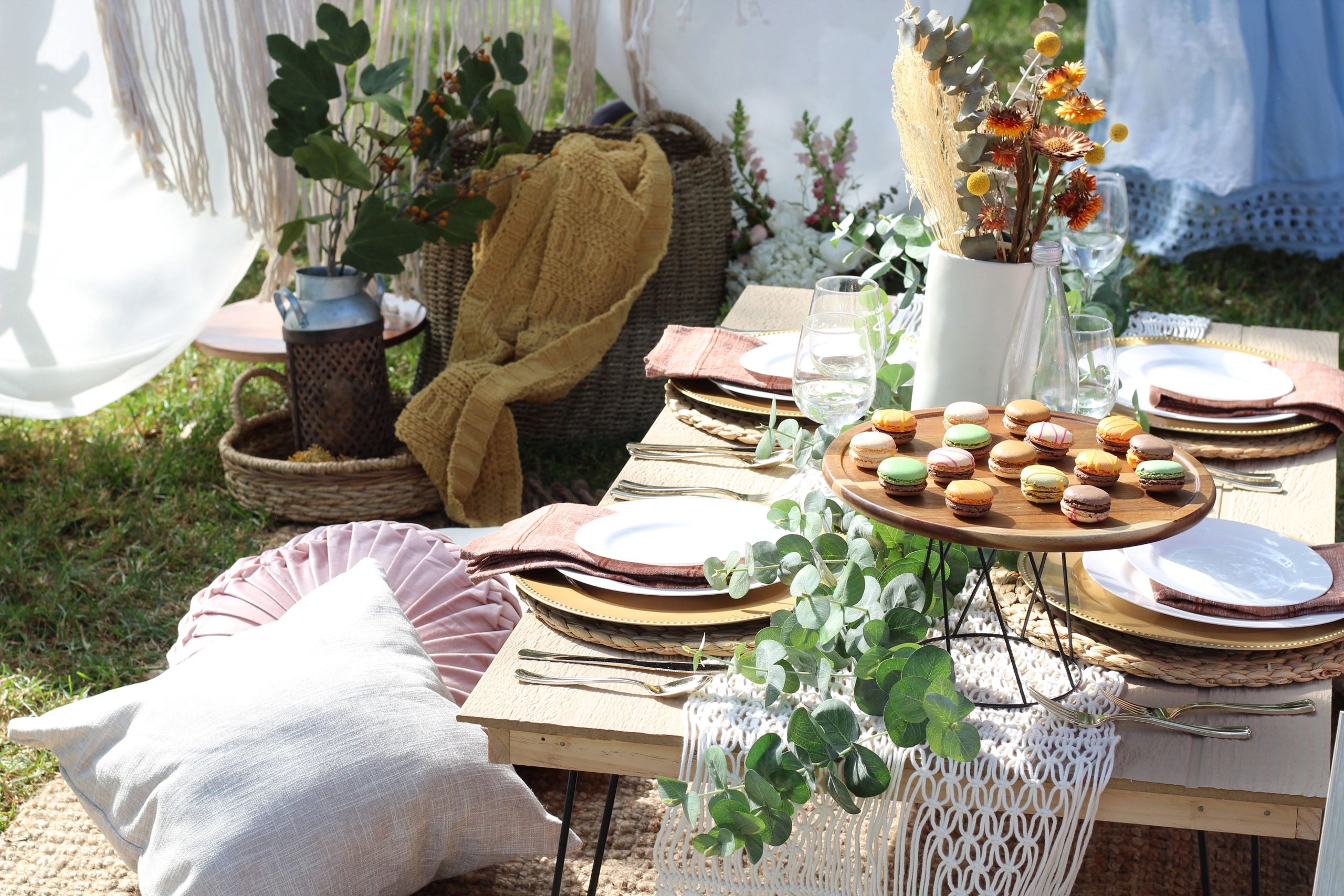 a surprise luxury pop up picnic set up in a park in cerritos, orange county with weaved baskets