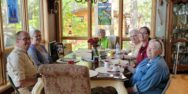 Parish nurses at 2022 Cabin Retreat in Lake Nebagamon with guest speaker, Rev. Jason Clifton.