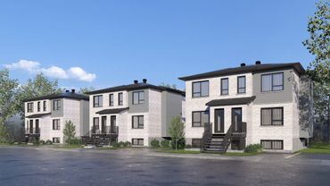 Row of modern two-story houses with beige exteriors and black trim.