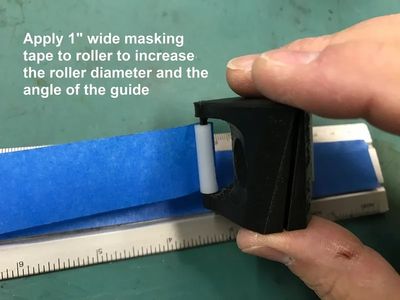 putting a blue tape on a scale