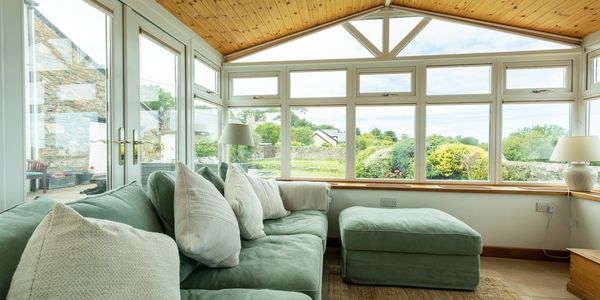 Relax in the conservatory space with extensive sea views.