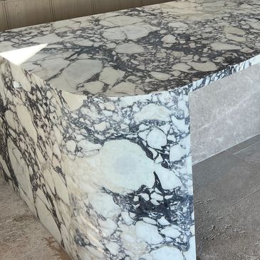 Natural stone Viola Marble and Porcelain kitchen island, backbenches and splashbacks. 
