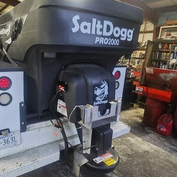 SaltDogg PRO2000 salt spreader attached to truck.