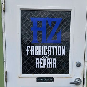 Door with signage for fabrication and repair business.
