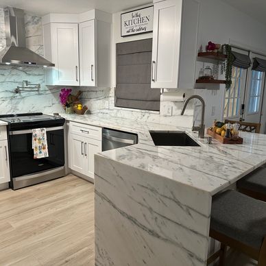 A sleek, functional kitchen with timeless elegance, featuring white cabinets and Contort.