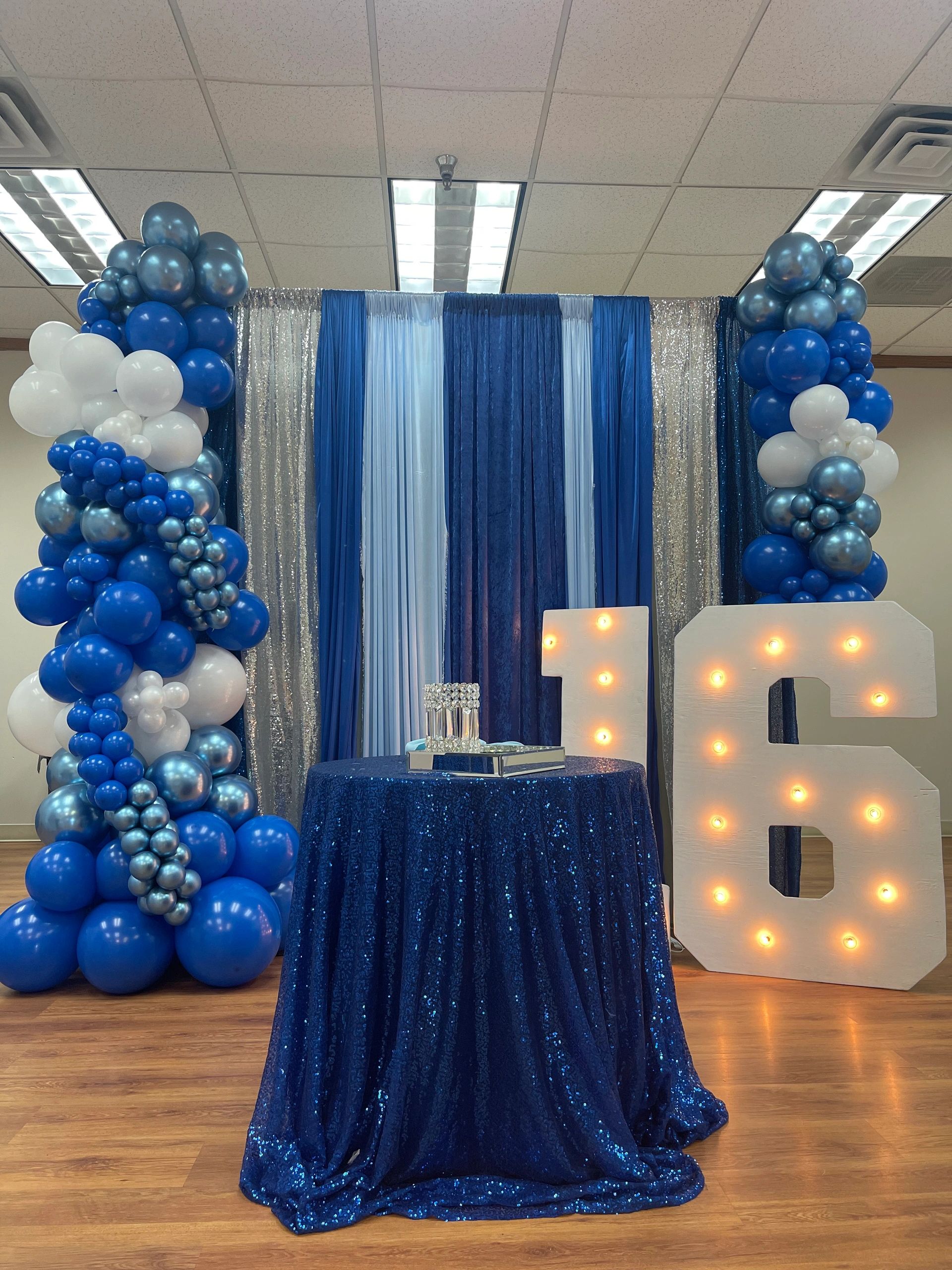 Sweet 16 Shades of Blue Balloon Garland, Marquee Numbers and Linen Backdrop.