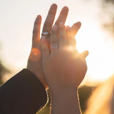 sunset with wedding rings