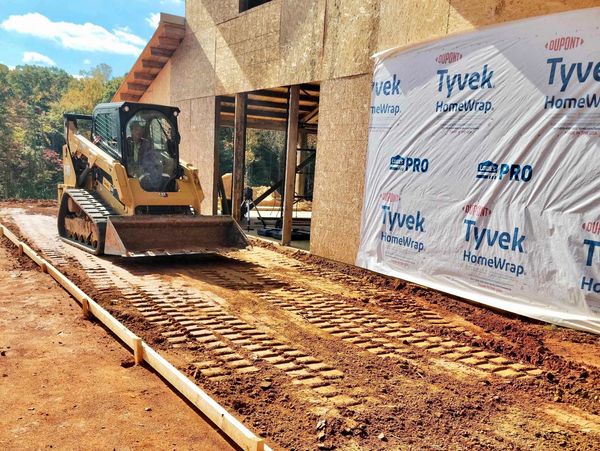 grading with Bobcat for concrete patio