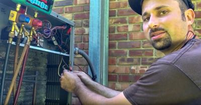 Joe Shearer doing maintenance on an air conditioning unit.  Maintenance is your friend!