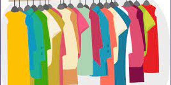 Colorful dresses hanging on a rack in a row.