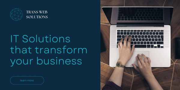 Hands typing on a laptop with IT solutions advertisement.