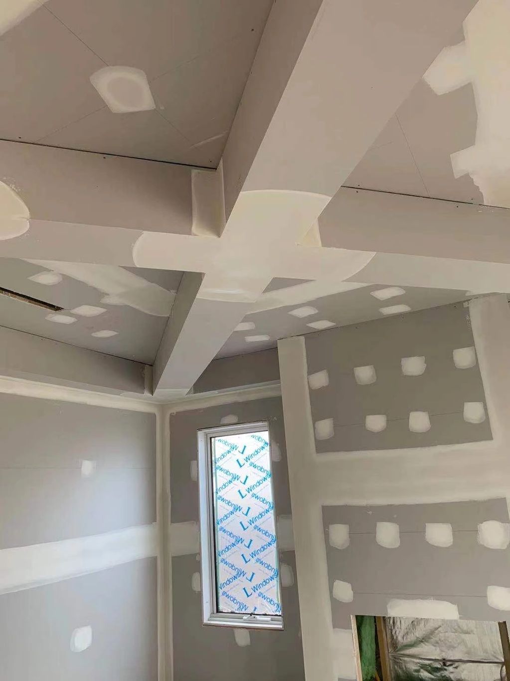 Working intently on a PUP wooden piece in the room.