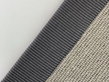 Close-up of textured fabric with gray and beige sections.