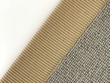 Close-up of three different textured fabric swatches in white, gold, and gray.