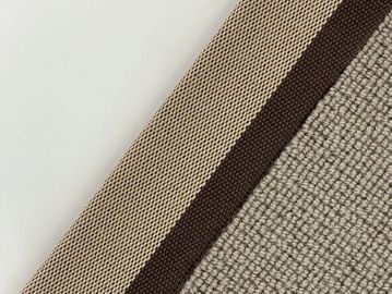 Close-up of fabric with beige, brown, and light gray textured stripes.