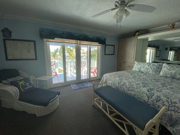 Interior image of the vacation rental room showing the sliding glass door entry, 