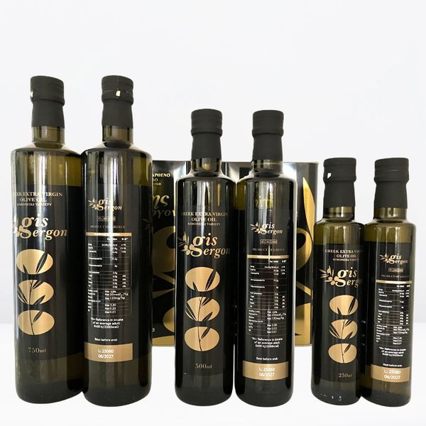 Elegant bottles of Greek extra virgin olive oil with gold and black labels.