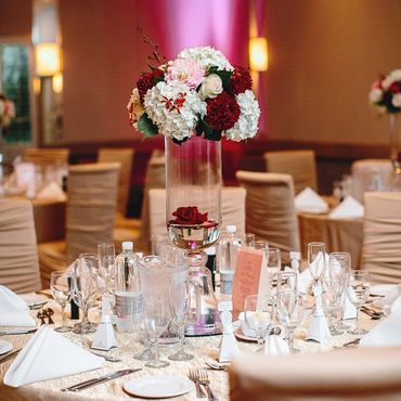 Elegant table setting with floral centerpiece at a formal event.