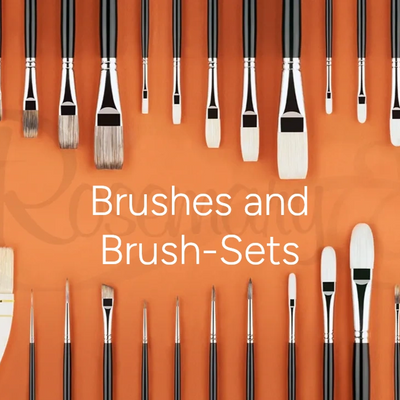 Various paintbrushes arranged on an orange background.