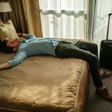 man sleeping on bed