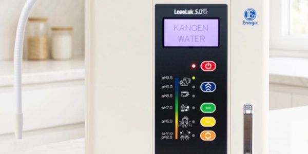 Close-up of a Kangen Water machine control panel in a kitchen setting.