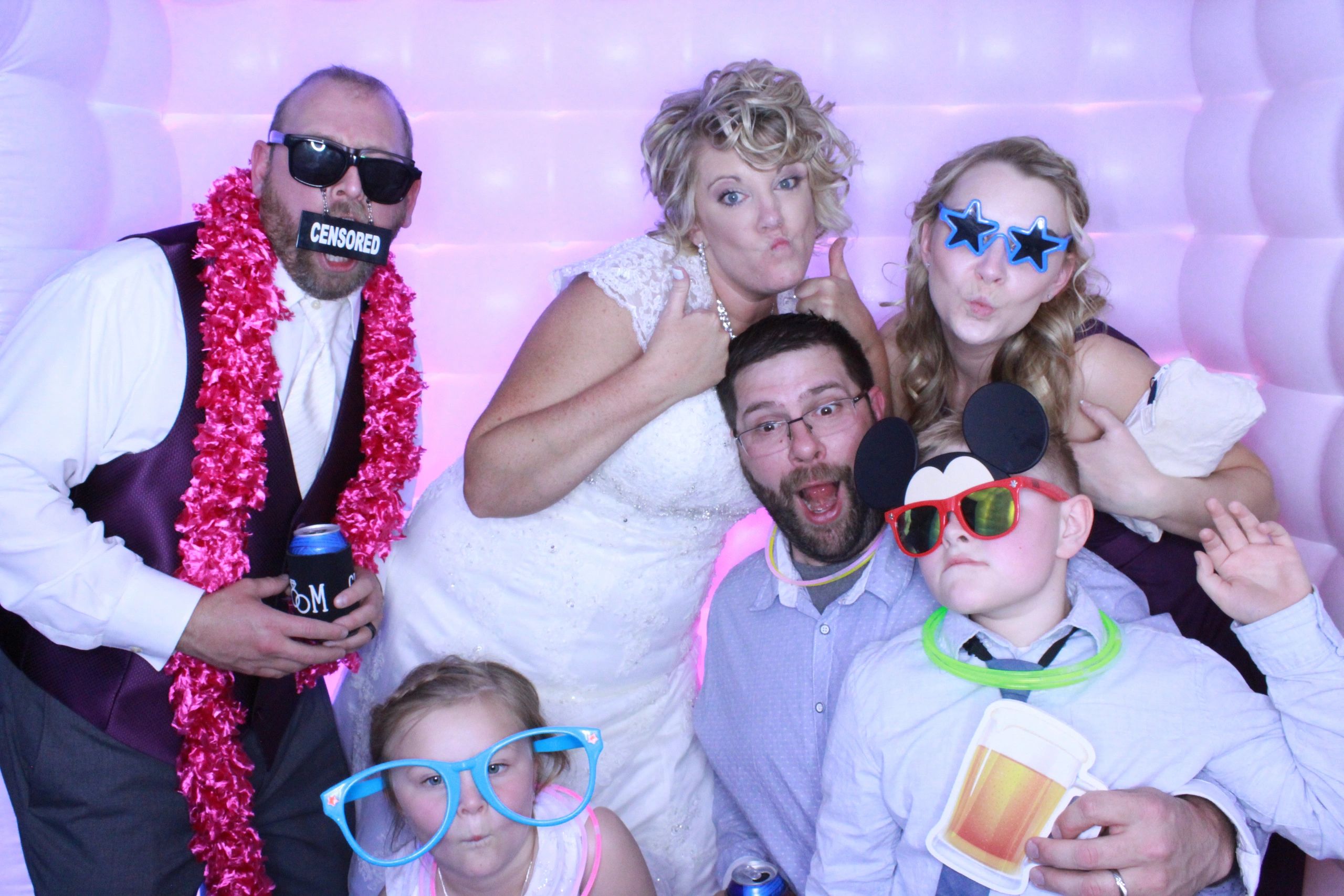 Bride and Groom with family in the photo booth.