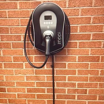 A Car Charger fixed on a wall