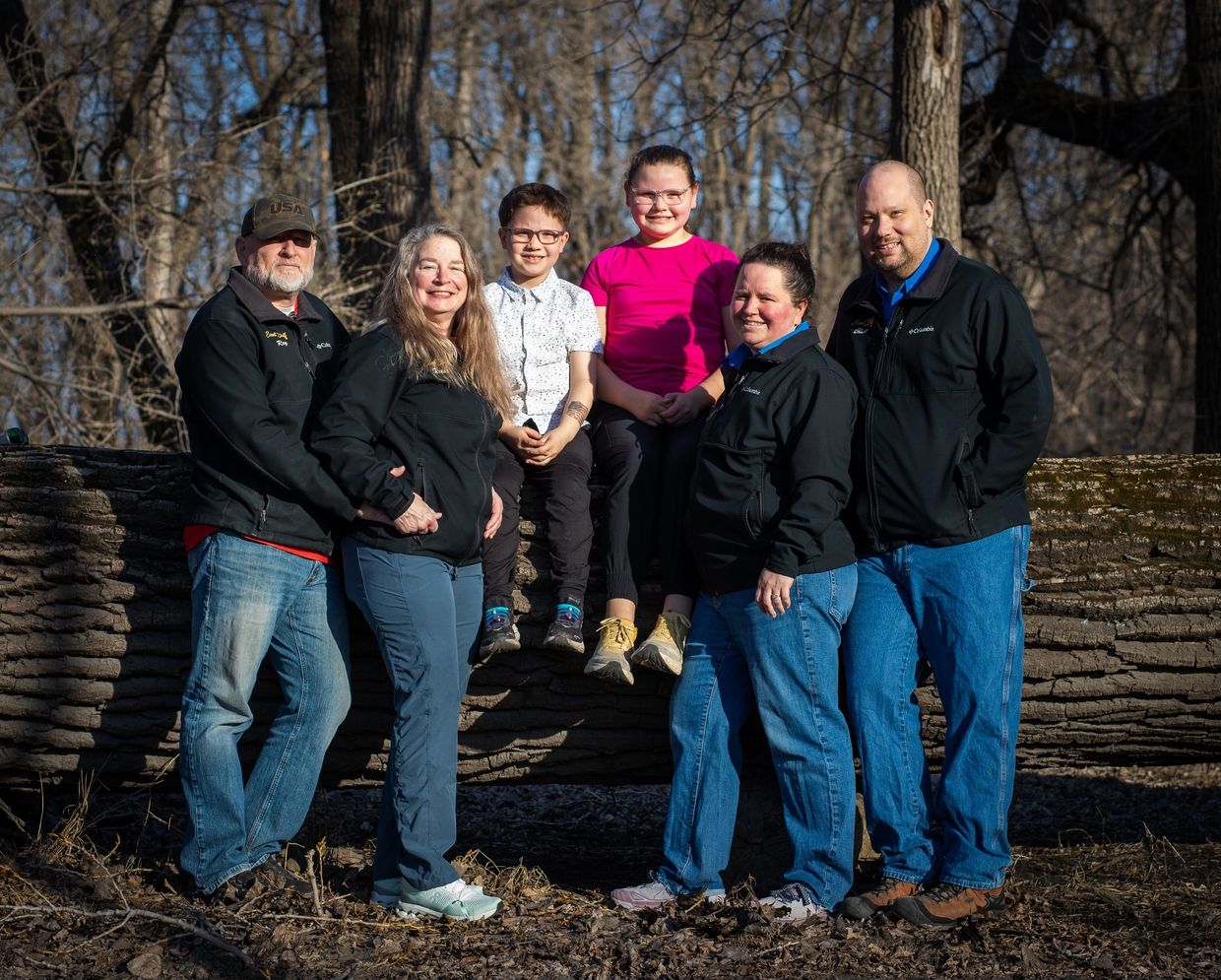 Family owned team at Romantic Moon Events Center, a wedding venue near Fargo, standing together outd